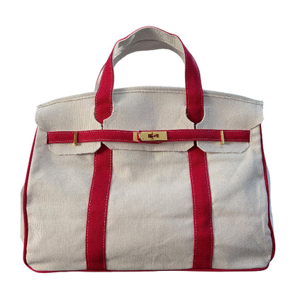 Red Boatkin bag with with gold hardware on a white background