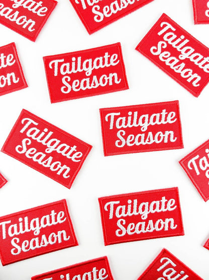 Red and white 'Tailgate Season' patches on a white background