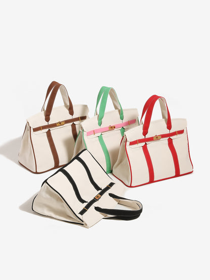 Four tote bags with different color combinations on a white background