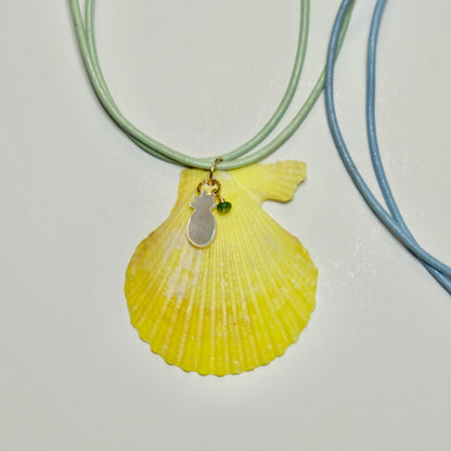 Yellow sea shell pendant necklace on a leather cord