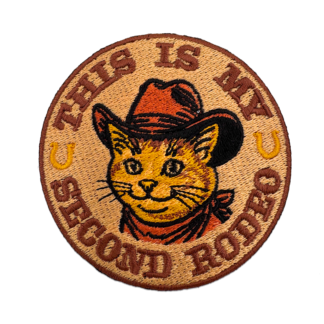 This Is My Second Rodeo embroidered iron-on patch with a cowboy cat in a Stetson