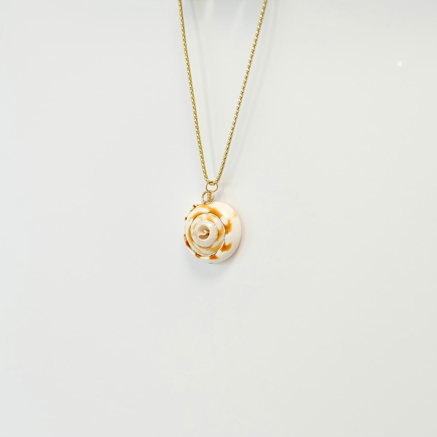 Handcrafted sea shell charm on 14k gold-filled wire with a spring clasp for easy transfer to any necklace.