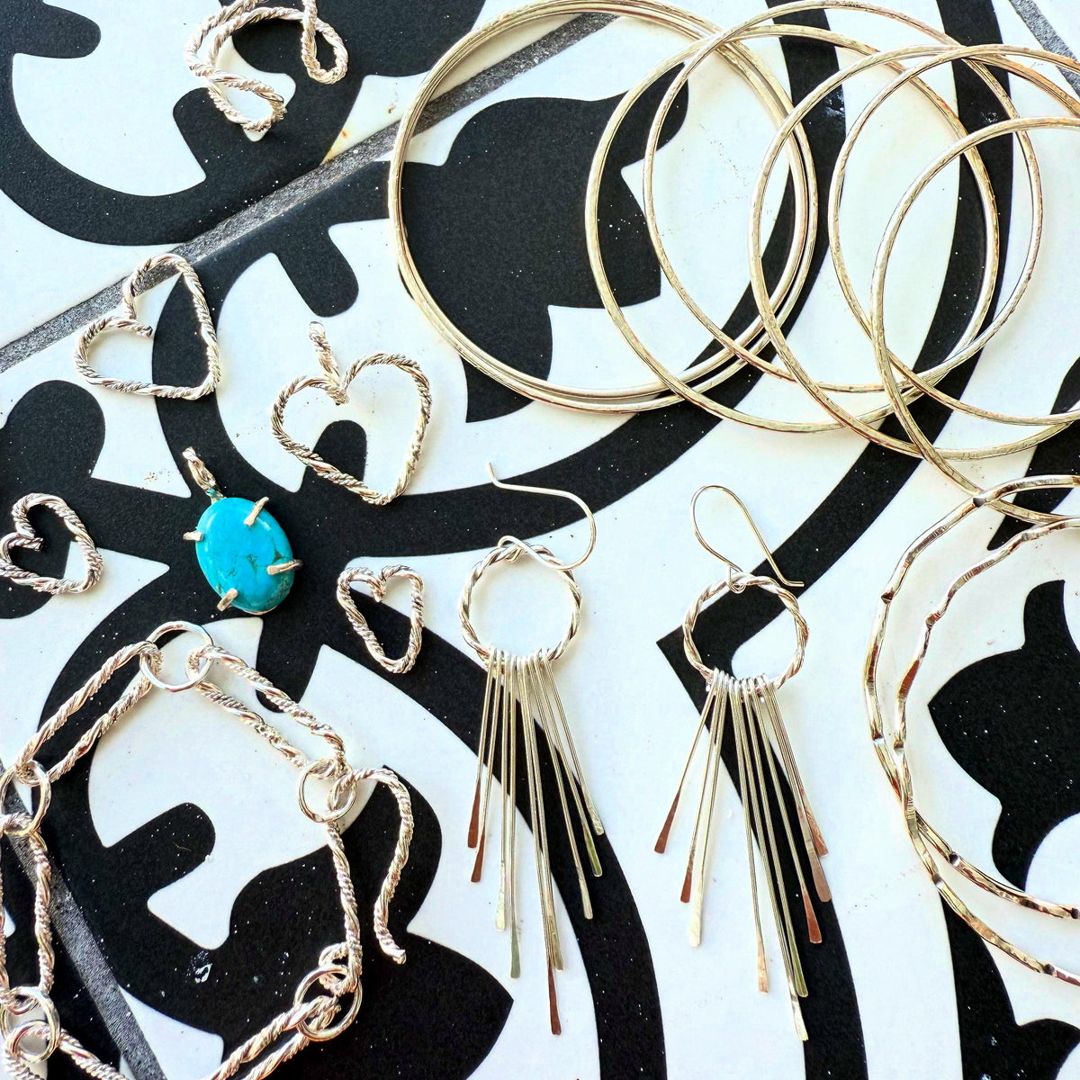 Handmade sterling silver braided heart charm