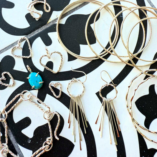 Handmade sterling silver braided heart charm