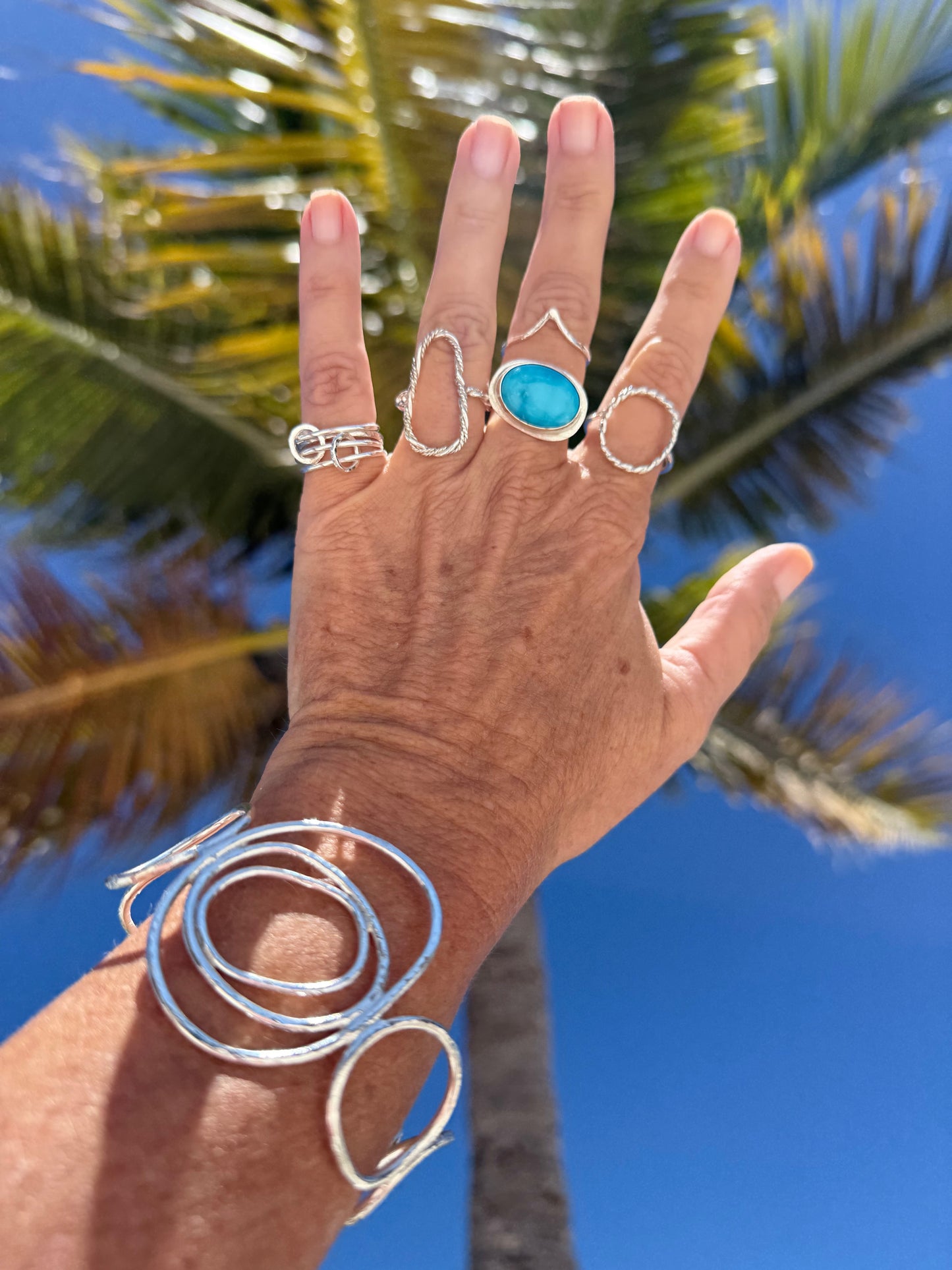 Silver cuff bracelet handcrafted in sterling silver, showcasing bold patterns for a modern and unique touch to your style.