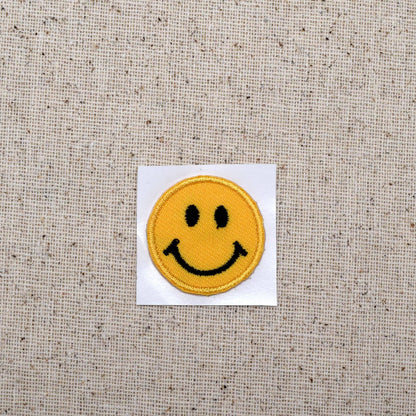 Small smiley face embroidered iron-on patch, view 3