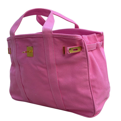 Solid pink Boatkin tote with gold hardware on a white background