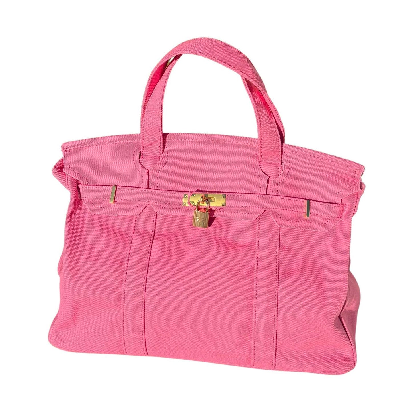 Solid pink Boatkin with a gold lock on a white background