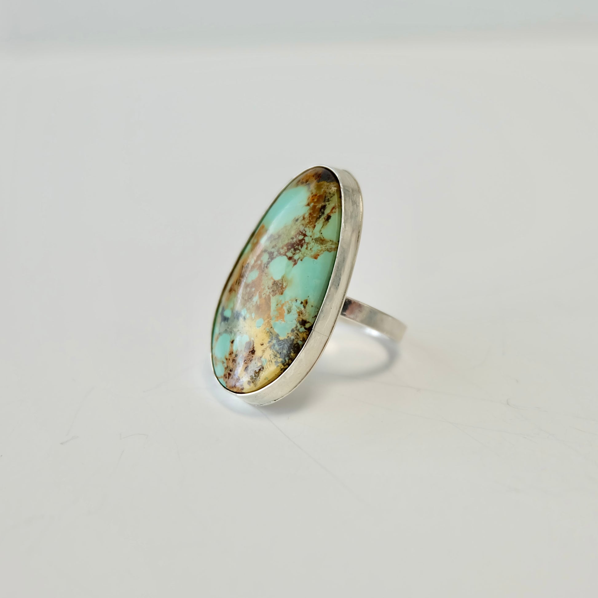 Stella blue turquoise ring on a light gray background