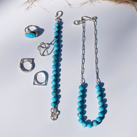 Sterling silver paperclip necklace featuring hand-forged links and natural Kingman turquoise beads