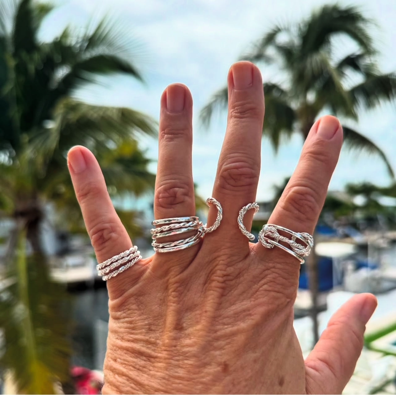 A collection of elegant sterling silver stacking rings, showcasing a variety of designs and textures for versatile styling.