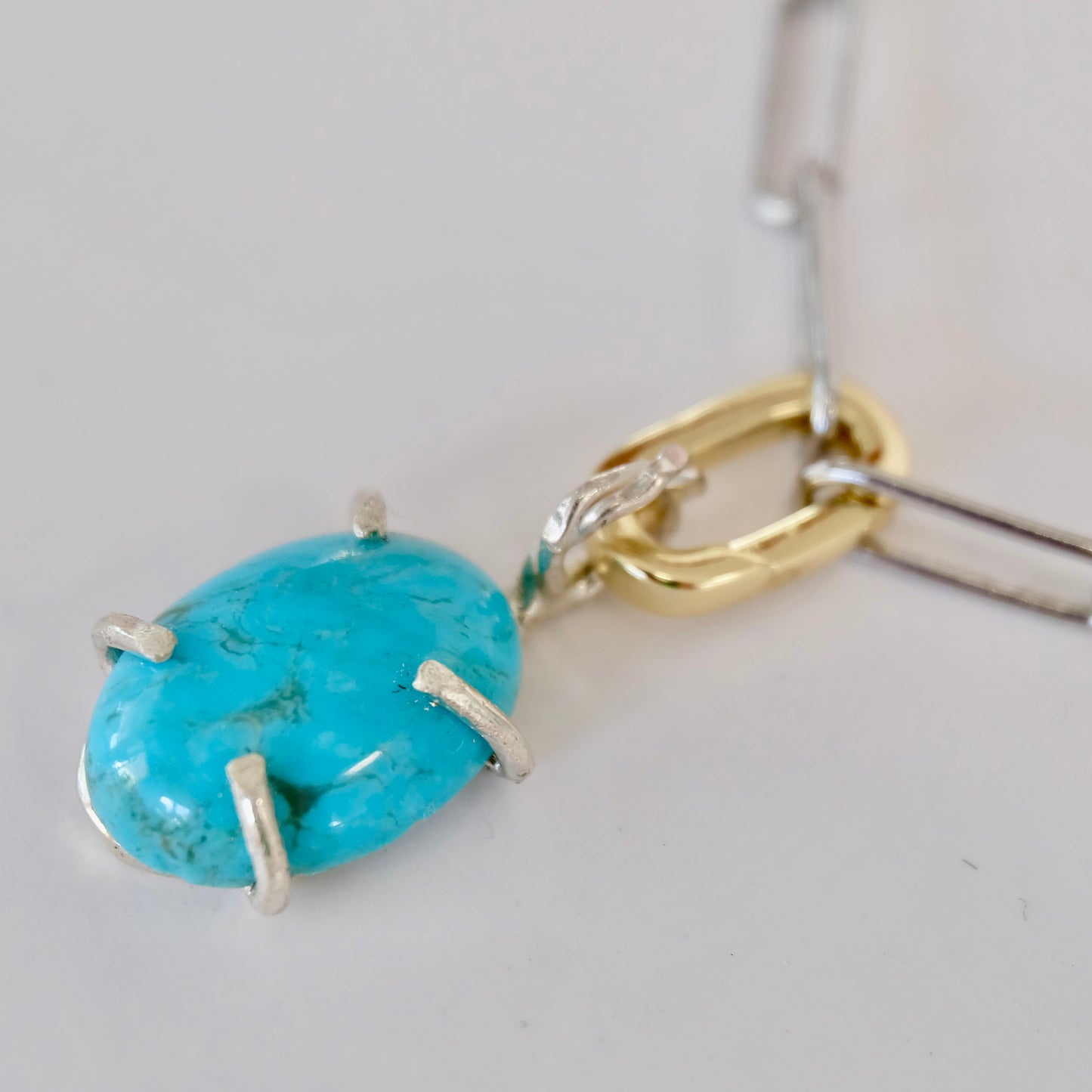 Unique turquoise charm crafted from sterling silver, highlighting vibrant Kingman turquoise, suitable for any event.