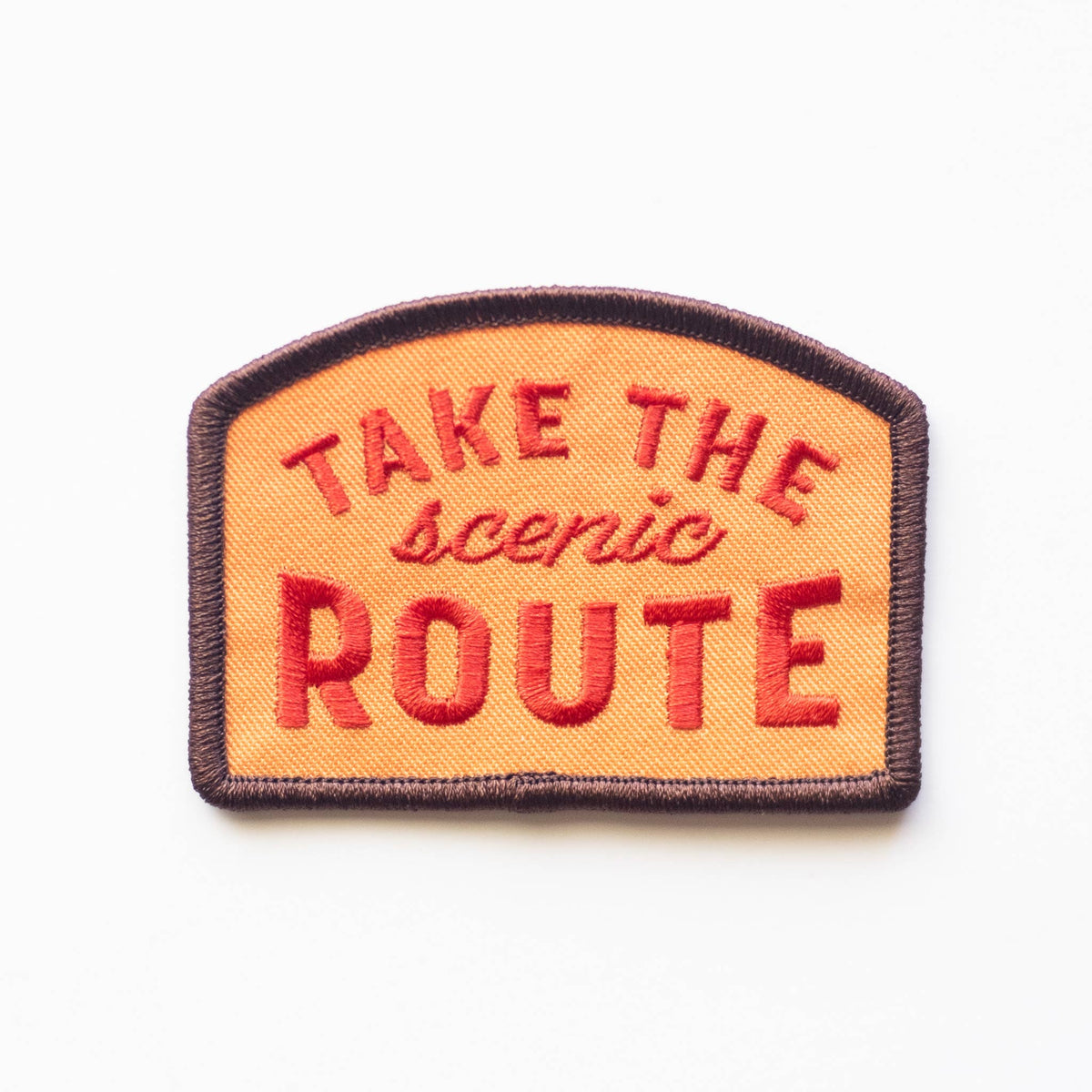 Take the Scenic Route embroidered iron-on patch in brown, orange, and red