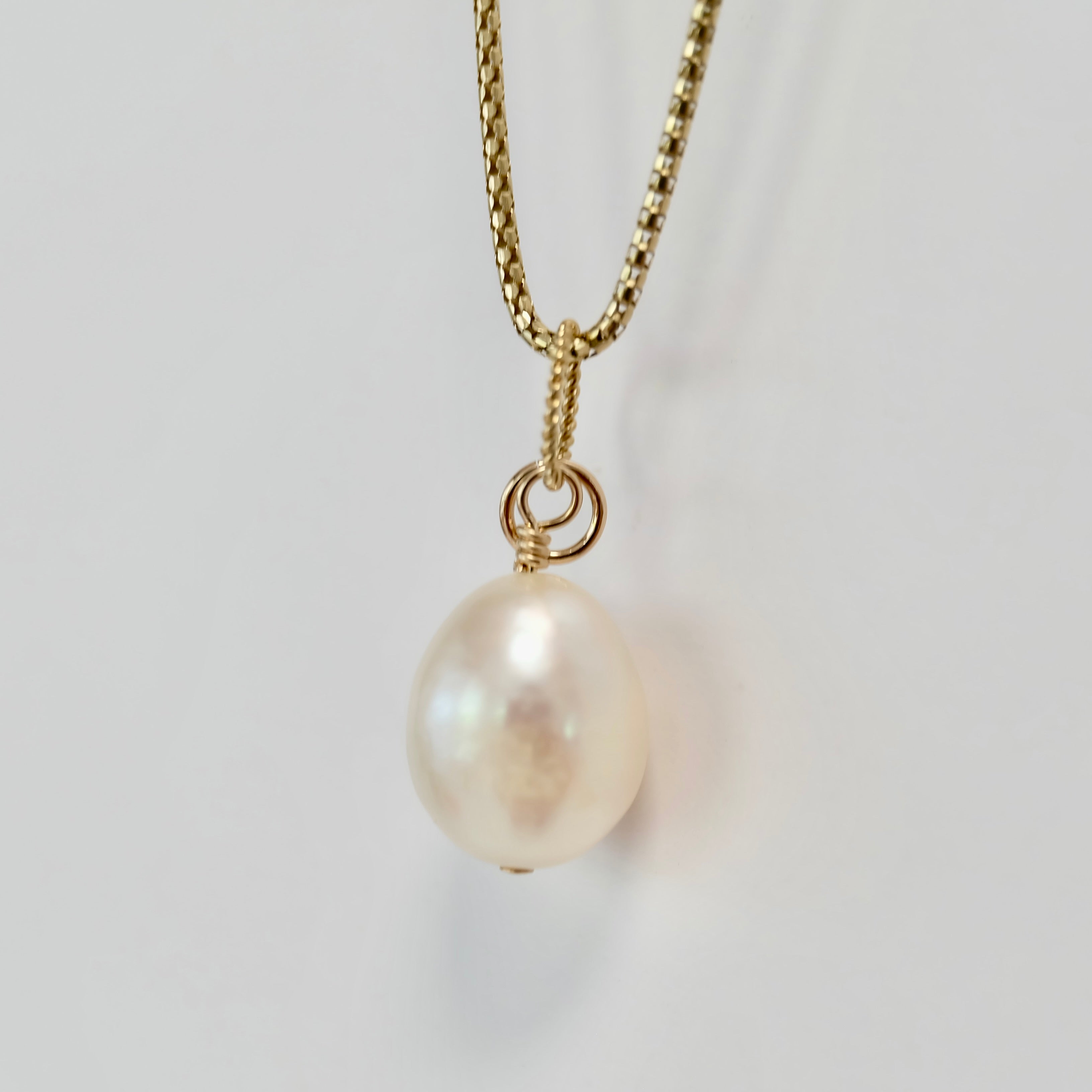 Teardrop pearl charm on 14K gold-filled wire with a spring clasp