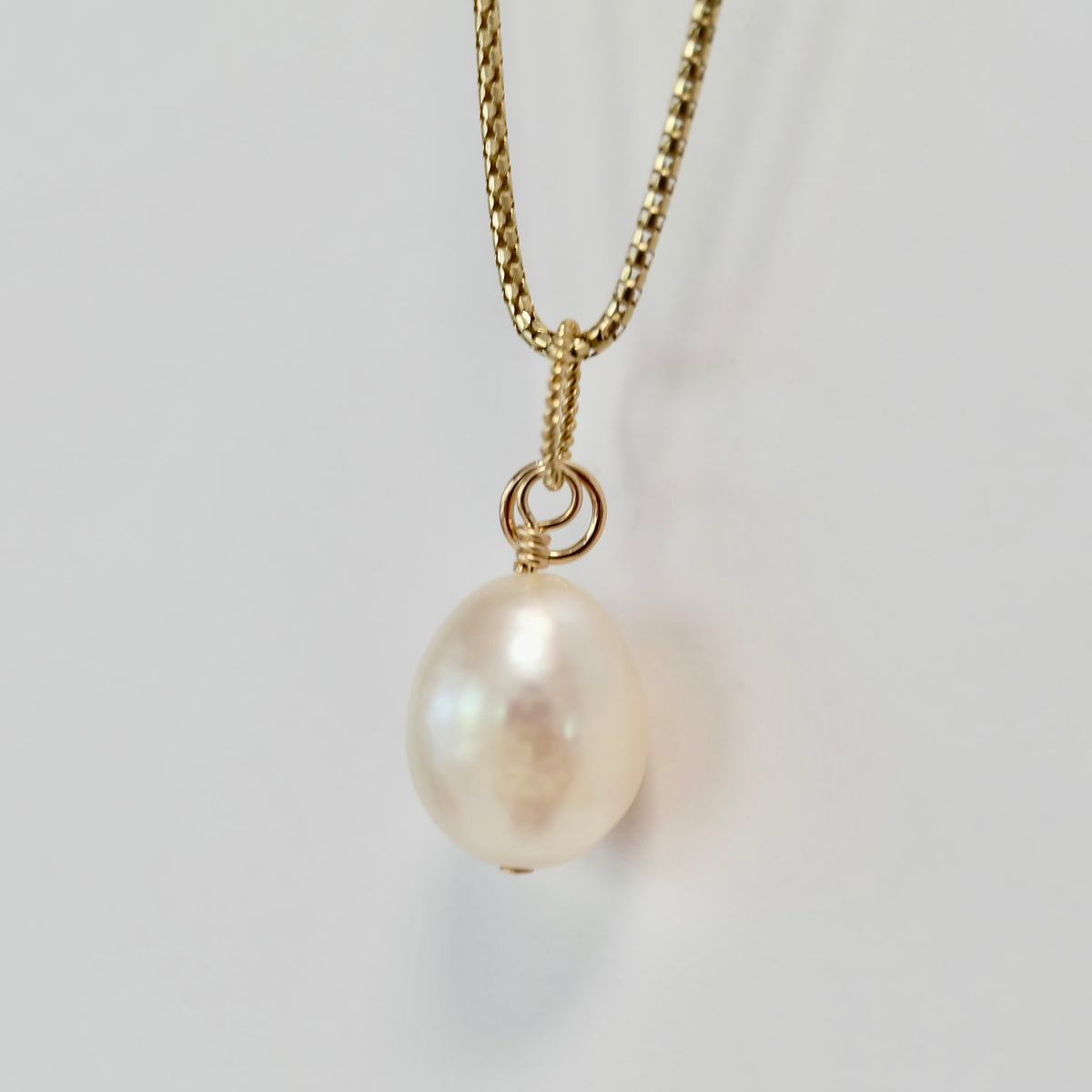 Teardrop pearl charm on 14K gold-filled wire with a spring clasp
