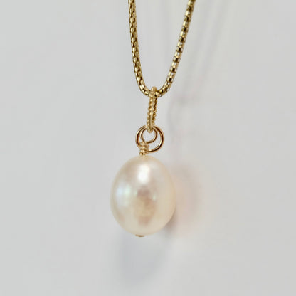 Teardrop pearl charm on 14K gold-filled wire with a spring clasp