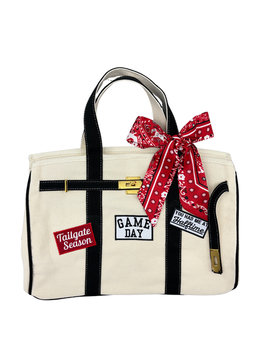 Texas Tech collegiate football tote featuring a red and black paisley twilly scarf bow, gold lock, and custom game day iron on patches.