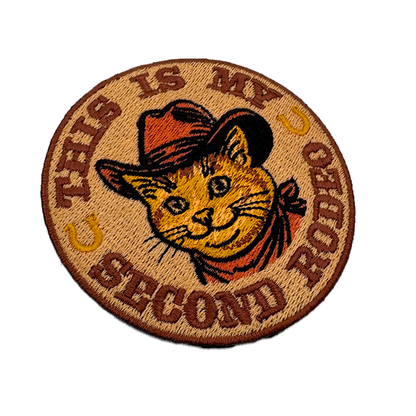 Orange tabby cowboy cat patch in a Stetson and red neckerchief, 3 inches round