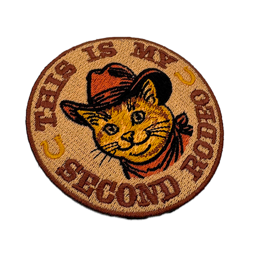 Orange tabby cowboy cat patch in a Stetson and red neckerchief, 3 inches round