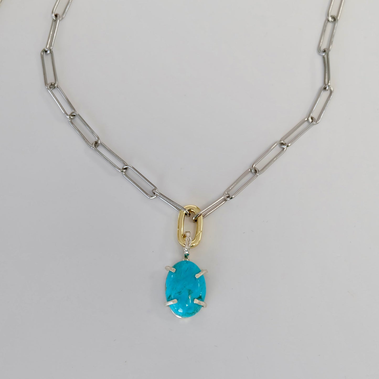 Exquisite turquoise charm in sterling silver, featuring vibrant Kingman turquoise, ideal for any occasion.