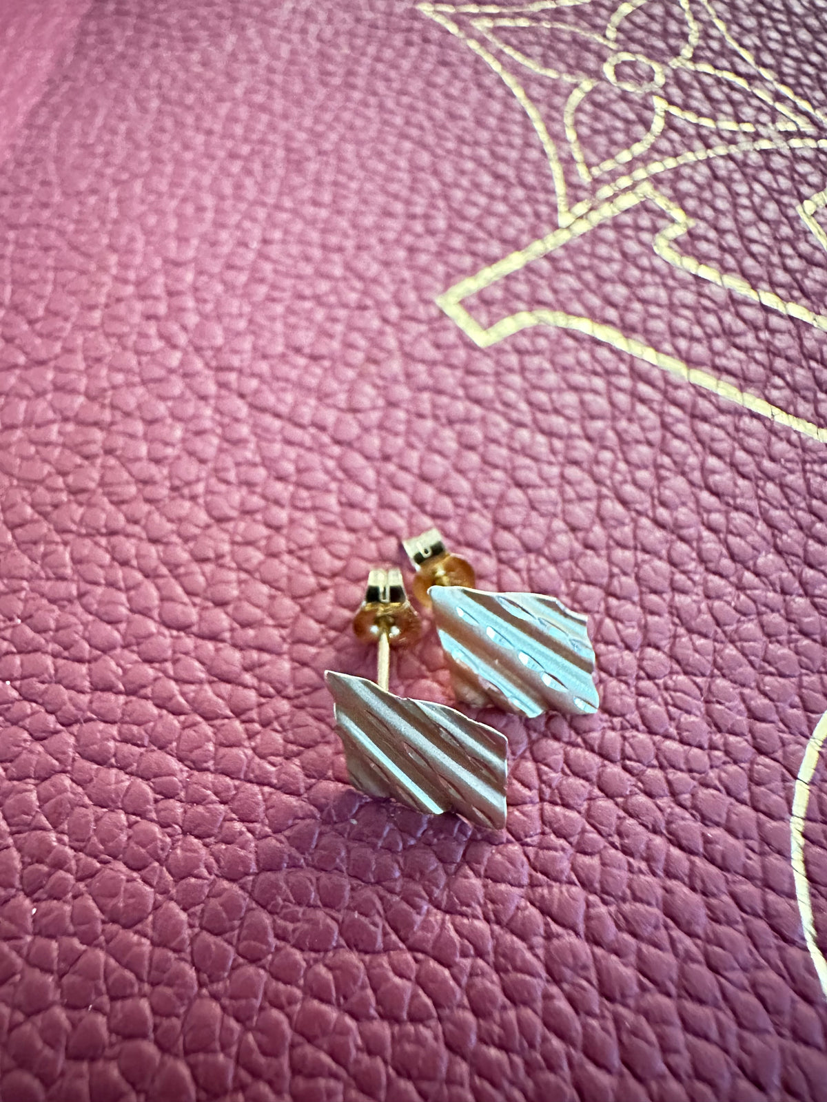 Vintage 14K gold triangle drop earrings with a wavy texture