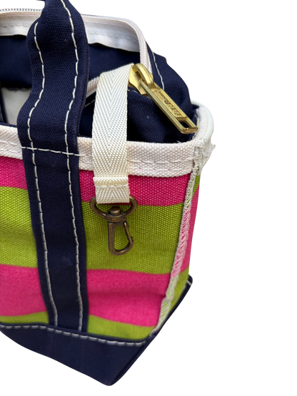 Side profile view of the vintage L.L. Bean mini canvas bag showing the alignment of the pink and green rugby stripe pattern along the side seams.
