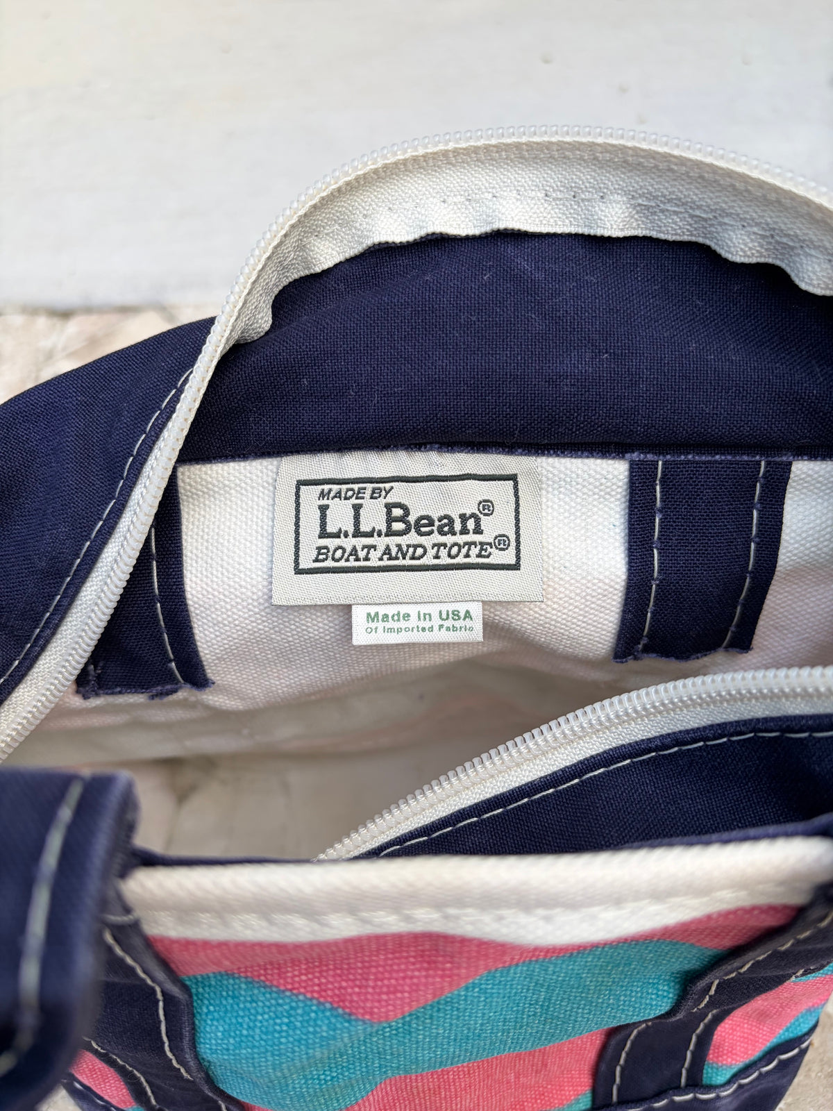 Label of the blue and pink rugby stripe vintage L.L. Bean mini tote.