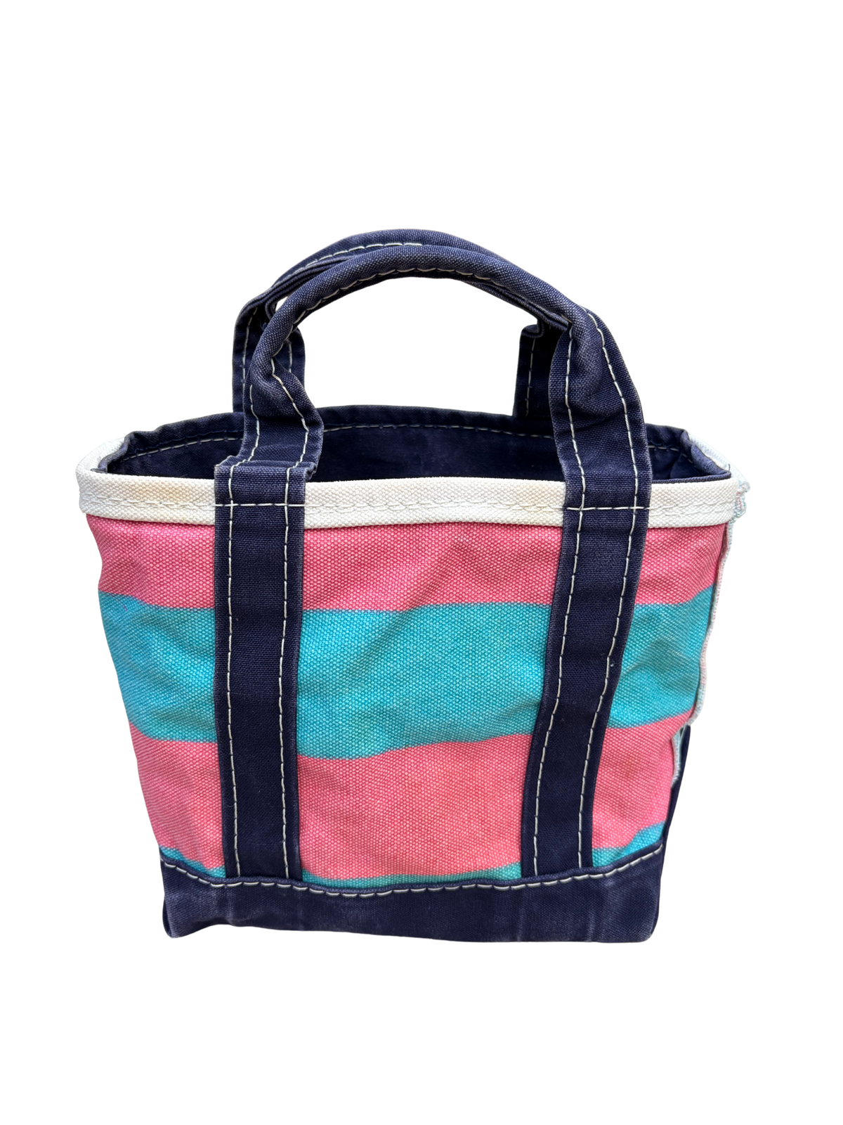 Full view of the reverse side of the vintage L.L. Bean mini canvas blue and pink rugby stripe tote bag standing completely upright.