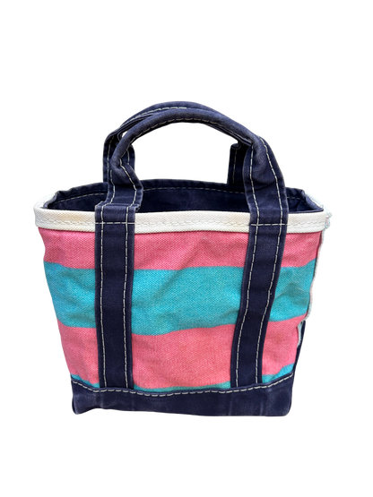 Full view of the reverse side of the vintage L.L. Bean mini canvas blue and pink rugby stripe tote bag standing completely upright.