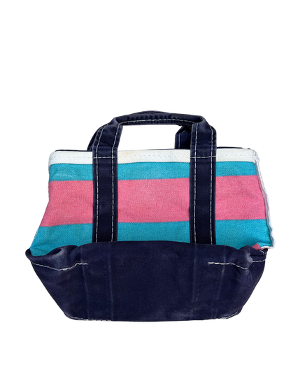 Bottom of the blue and pink rugby stripe vintage L.L. Bean mini boat and tote bag showing its scale and structural shape.