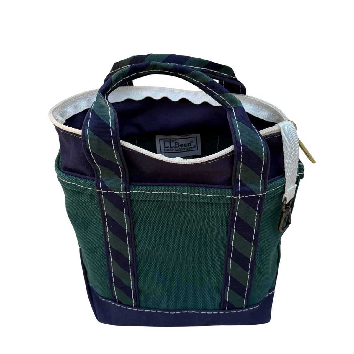 Interior of vintage L.L. Bean regimental stripe tote showing clean lining and zip closure