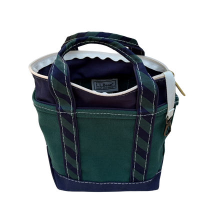 Interior of vintage L.L. Bean regimental stripe tote showing clean lining and zip closure