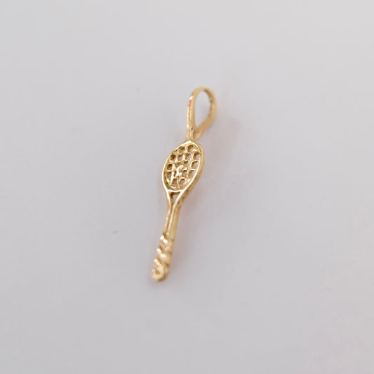 A vintage tennis racquet charm featuring 14k gold displayed on white background. 