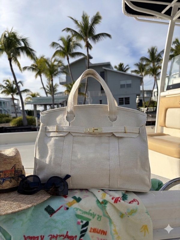 White Boatkin bag on a boat with palm trees and buildings in the background