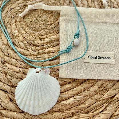 White fan shell pendant necklace with rose quartz, close-up detail