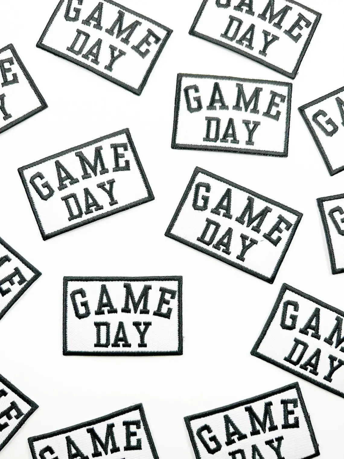 Pattern of 'GAME DAY' text on a white background