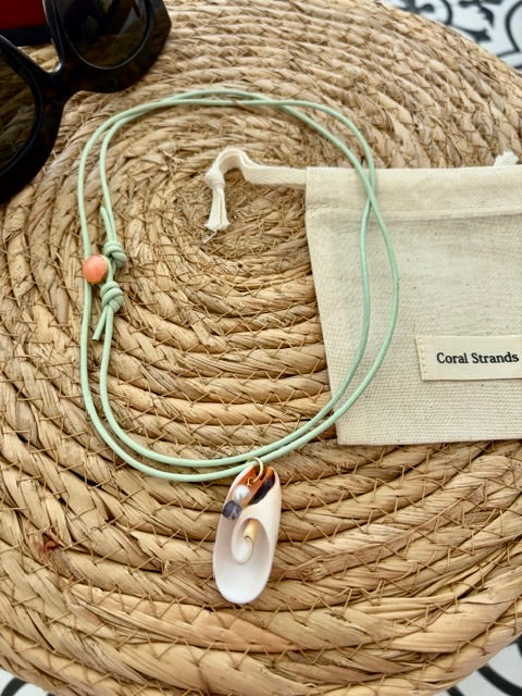 White spiral shell pendant with pearl, and iolite close-up