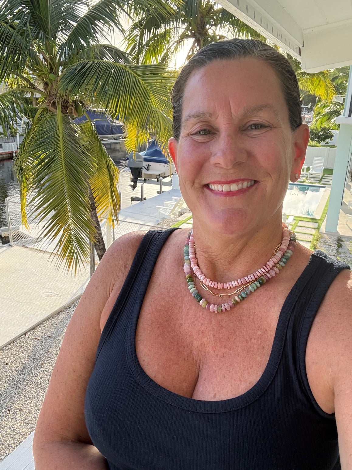 woman wearing tourmaline necklace