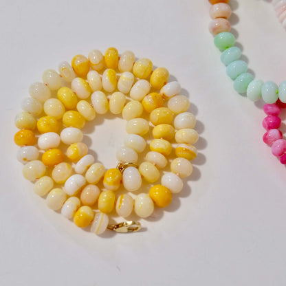 Yellow opal beaded candy necklace hand-knotted on coral silk with a 14K gold-filled clasp